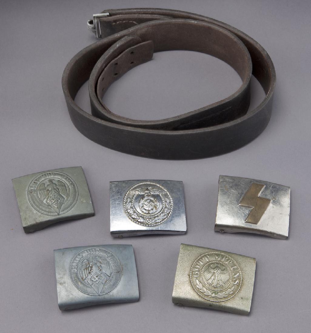 (5) WWII German belt buckles,: (5) WWII German belt buckles, with one belt, comprising: (3) Hitler youth; (1) political; (1) Weimar. 20th C. CONDITION: Wear consistent with age and use. Circa -