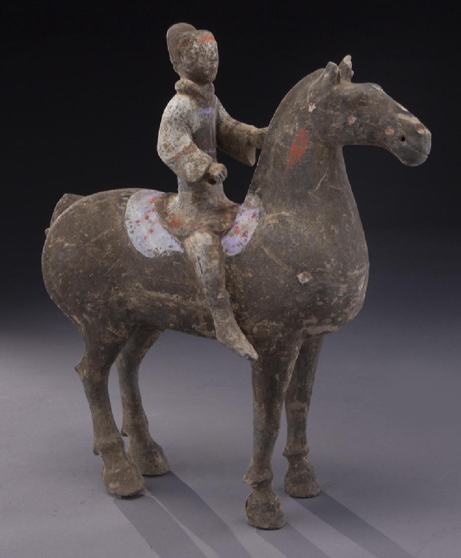 Terra cotta figure of a warrior atop horse. (1 of 2)