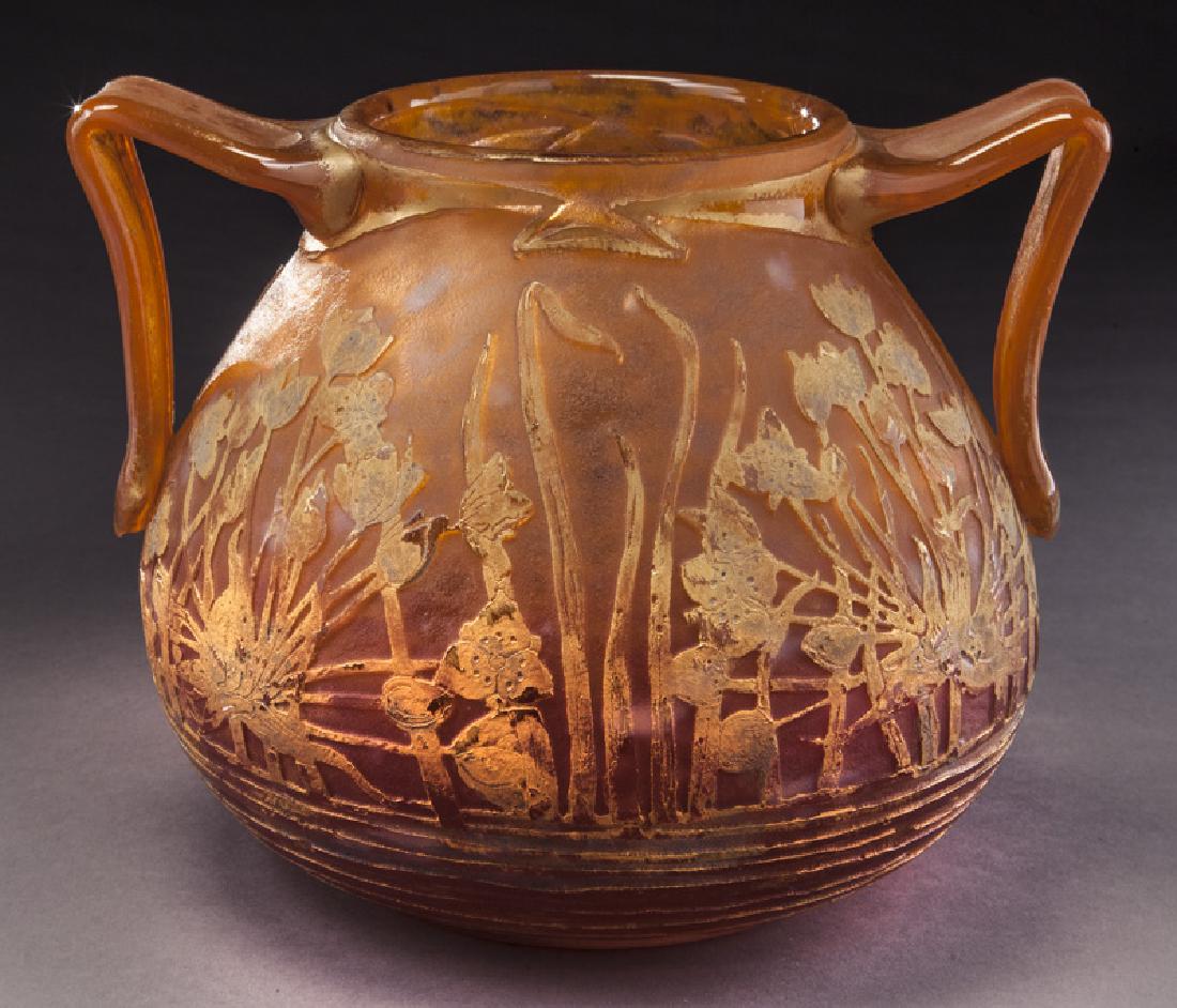 Daum Nancy two-handled vase,: Daum Nancy two-handled vase, ovoid modeled crimson glass vase decorated with a garden of gold and platinum foliage. Signed, "Daum Nancy". 8"H, Circa - 1900. PROVENANCE: From the Estate of John W. Loll