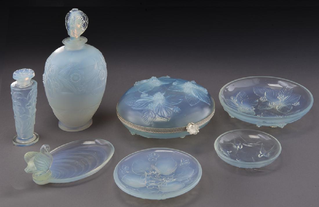 (7) Pcs. Sabino opalescent table articles,: (7) Pcs. Sabino opalescent table articles, comprising: (1) swan dish; (1) circular dish with bird motif; (2) perfumes with floral detail; (1) hinged lidded box; (2) floral dishes. Tallest: 8"H, Circa 