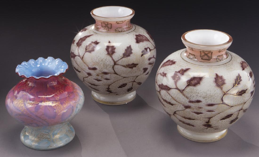 (3) Graf Harrach air trapped glass vases: (3) Graf Harrach air trapped glass vases Pr. of white shouldered vases with purple leaves and gold tracery; (1) bulbous ruffled rim in crimson with blue air trapped leaves and gold tracery. Circa - 19