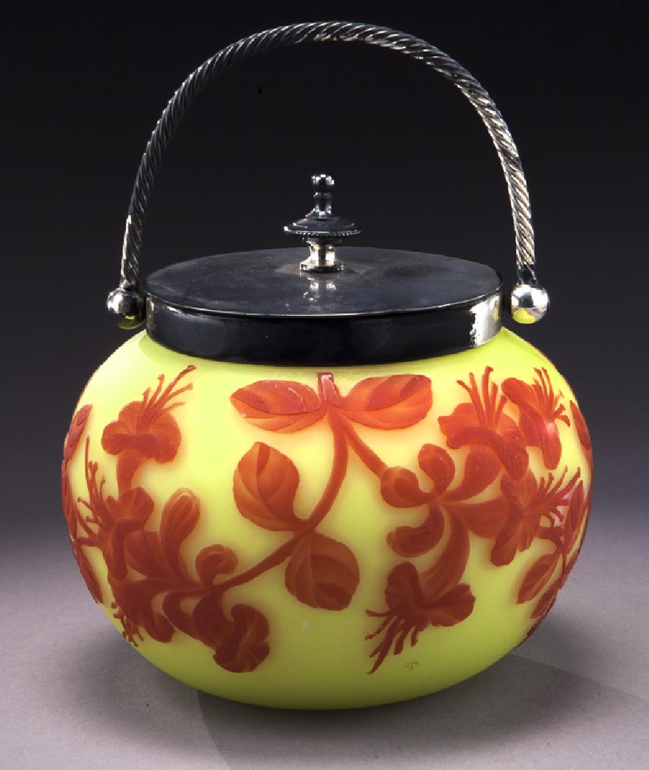 Webb cameo lidded bowl: Webb cameo lidded bowl with crimson trumpet tulip design to yellow ground, surmounted by silvered metal lid with twisted handle. 4.5"H over finial, Circa - 1890. PROVENANCE: From the Estate of John W.