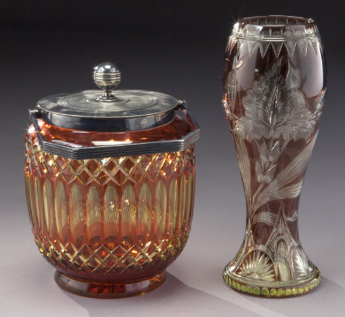 (2) Stevens & Williams translucent items,: (2) Stevens & Williams translucent items, including: (1) purple vase with cut flower; (1) cranberry over amber biscuit jar. Taller: 8"H, Circa - 1890. PROVENANCE: From the Estate of John W. Lolley, Mo