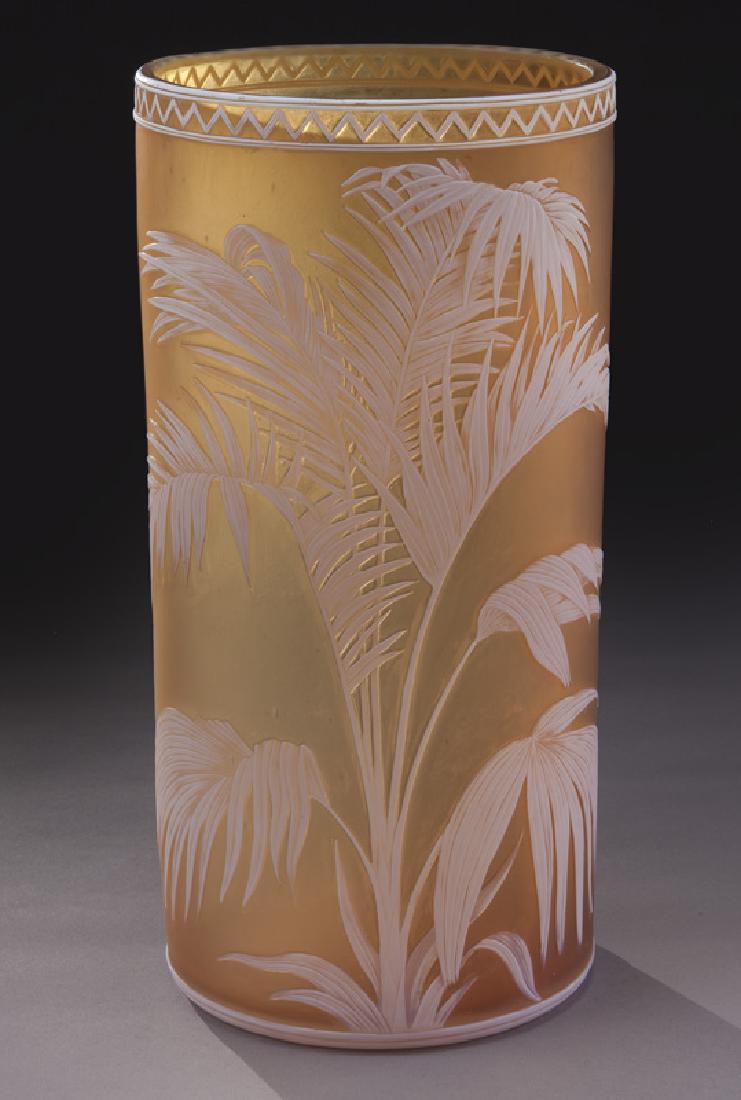 Signed Thomas Webb & Sons English cameo vase,: Signed Thomas Webb & Sons English cameo vase, large cylindrical form in satinized raisin, decorated with a spreading fern and butterfly on verso. 11"H, Circa - 1890. PROVENANCE: From the Estate of Joh