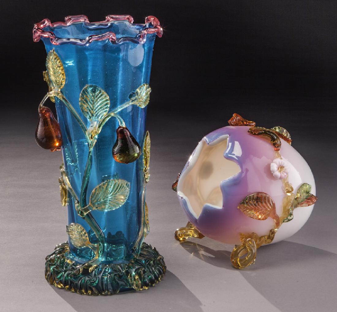 (2) Applied glass items,: (2) Applied glass items, including: (1) Stevens & Williams Prussian blue with applied vasoline stems and crimson pears; (1) peach blow set down egg with applied branches and pink flowers. 11"H, Circa 