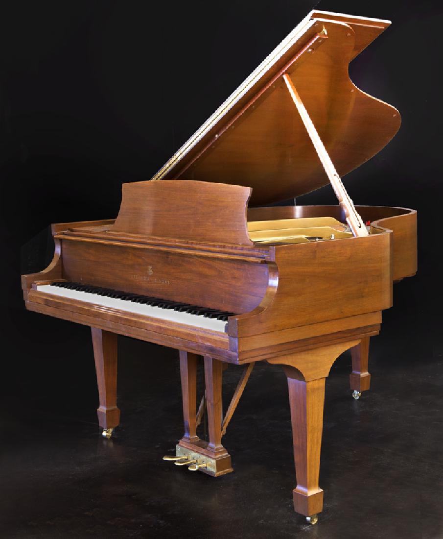 Steinway grand piano Model M,: Steinway grand piano Model M, raised on tapered legs, block feet, and castors. Serial#: 502651. Case: 38.5"H, Circa - 1986.