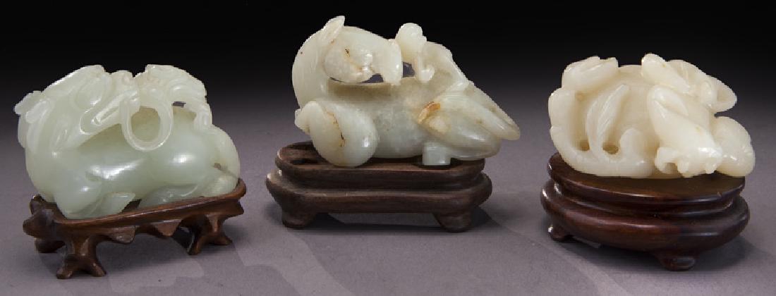 Chinese Qing carved jade toggles,: Chinese Qing carved jade toggles, depicting a monkey riding on a horse, a pomegranate, and a kylin. Largest: 2.25"L, Circa - 19th C.