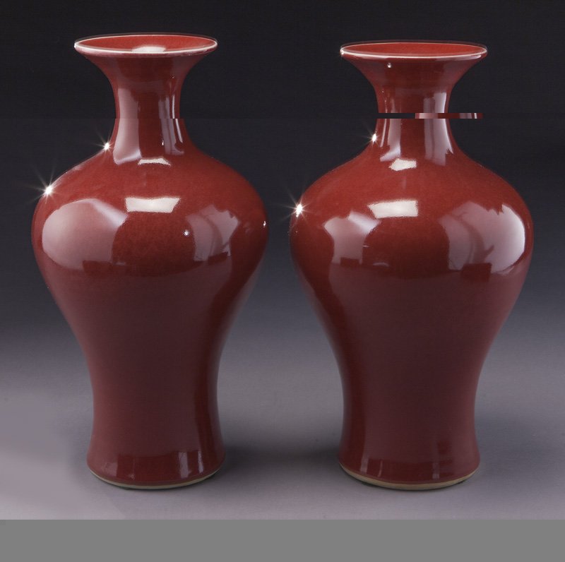 Pr. Chinese Qing ox blood porcelain vases.: Pr. Chinese Qing ox blood porcelain vases. 15.25"H, Circa - 19th C.