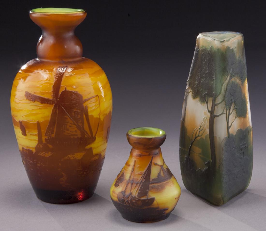 (3) Muller Freres French cameo glass vases,: (3) Muller Freres French cameo glass vases, including: (1) a shouldered yellow vase with windmill; (1) diminutive yellow vase with ships; (1) triangular with tree scene. Each signed in cameo. Tallest: