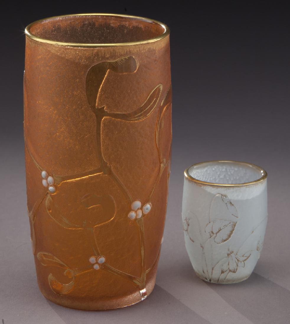 (2) Daum Nancy cameo glass vases,: (2) Daum Nancy cameo glass vases, including: (1) barrel formed with mistletoe and (1) powder blue cordial. Each signed, "Daum Nancy". Taller: 4.75"H, Circa - 1900. PROVENANCE: From the Estate of John