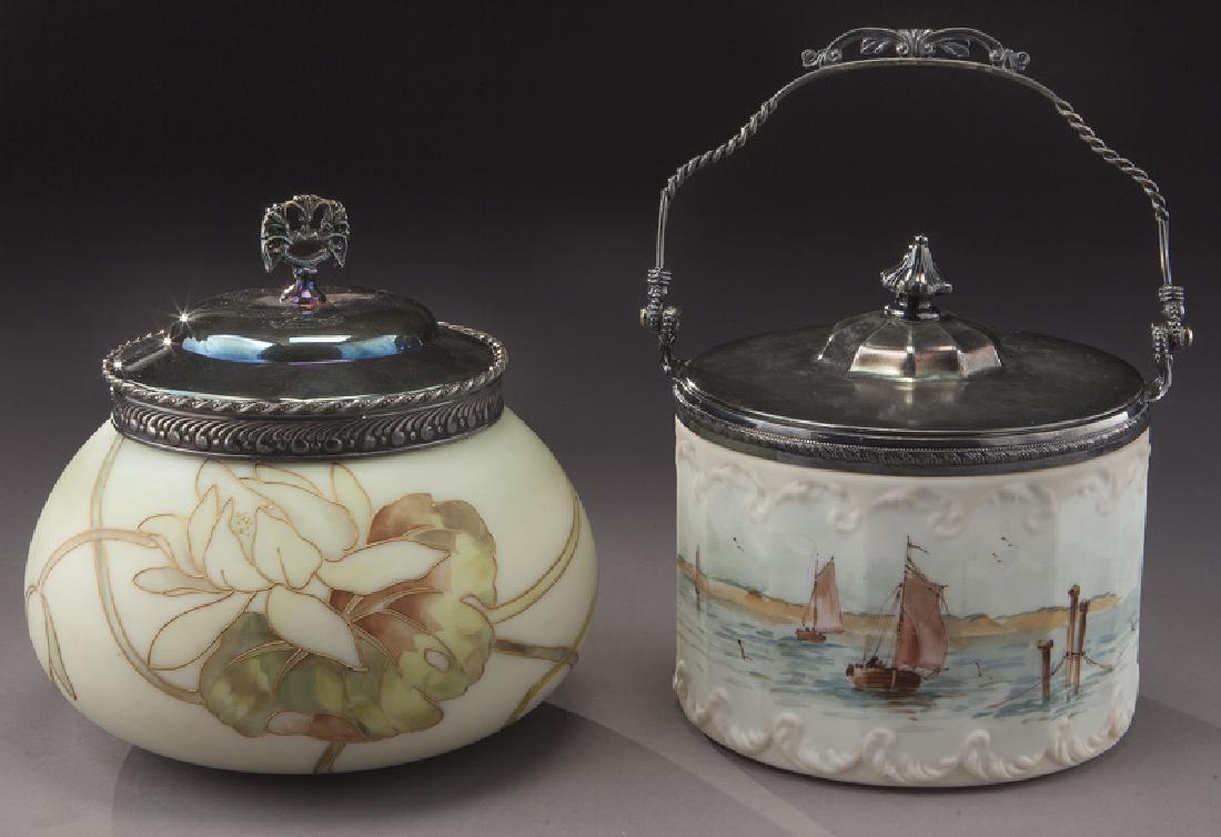 (2) Mt. Washington/Pairpoint covered jars,: (2) Mt. Washington/Pairpoint covered jars, including: (1) dresser jar with waterlilies, signed "MW"; (1) faceted Pairpoint with sailing ships. 7"H, Circa - 1890. PROVENANCE: From the Estate of John W.