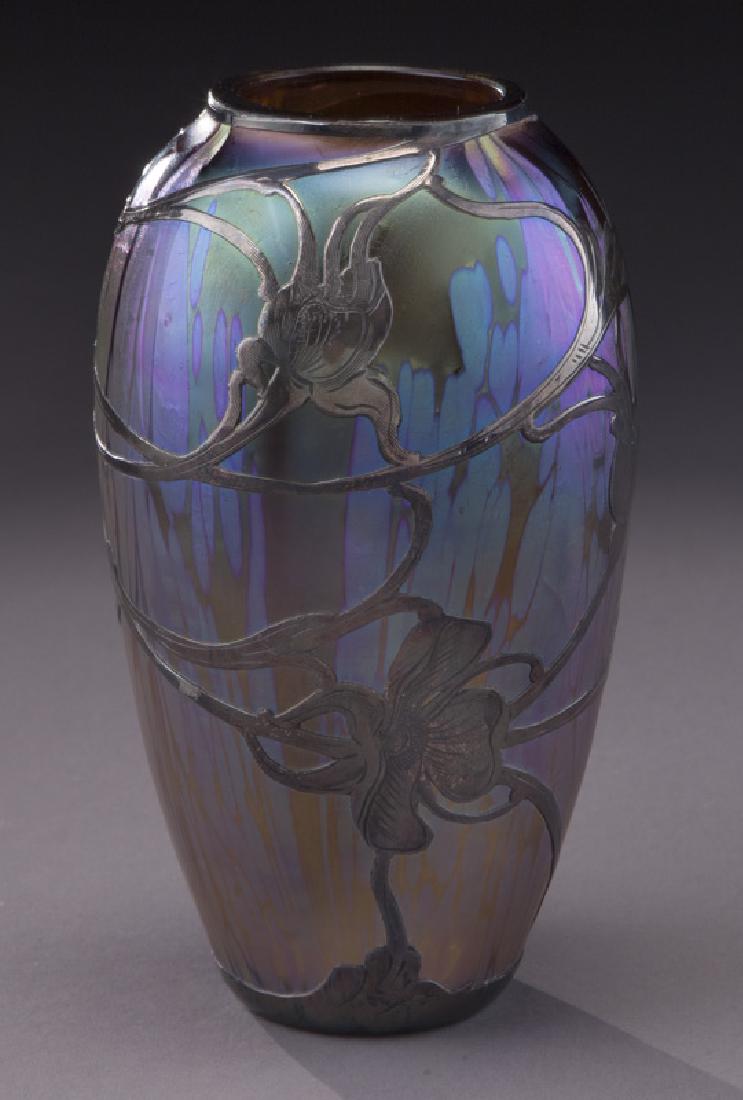 Loetz silver overlay blue vase: Loetz silver overlay blue vase in a purple papillion finish. 5"H, Circa - 1900. PROVENANCE: From the Estate of John W. Lolley, Monroe, Louisiana.
