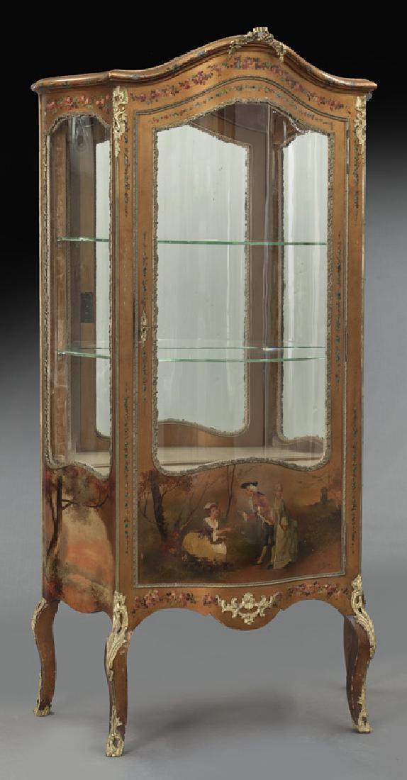 Vernis Martin style ormolu mounted vitrine: Vernis Martin style ormolu mounted vitrine with curved glass sides and door over a bombe shaped lower section with painted scenes, interior having two glass shelves, mirrored back and lighted interior