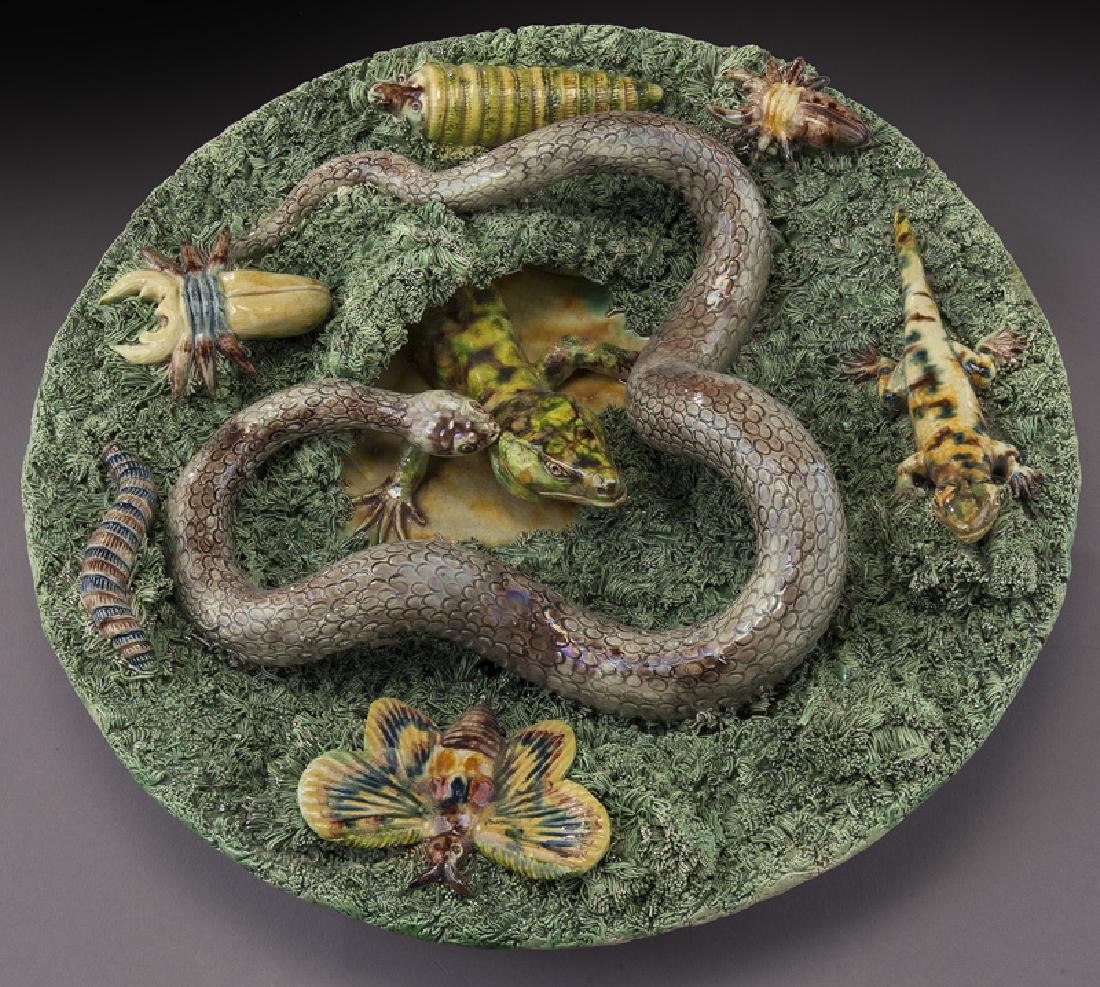 Portuguese Palissy plate decorated with a snake,: Portuguese Palissy plate decorated with a snake, lizard, butterfly, caterpillar, etc., on a moss covered background. Impressed mark for Jose A. Cunha, Caldas Rainha, Portugal. 11.5" Dia., Circa - 1860