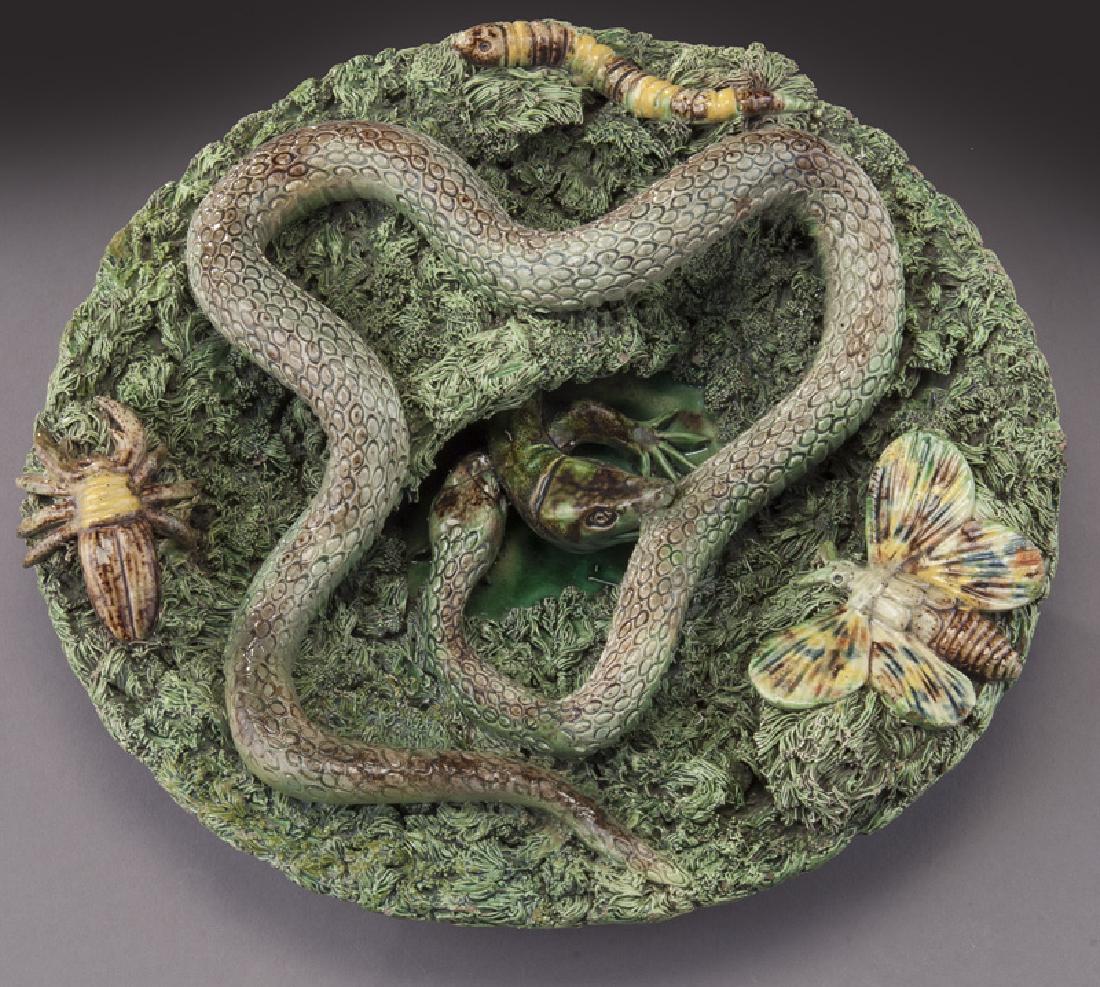 Portuguese Palissy plate decorated with a snake,: Portuguese Palissy plate decorated with a snake, lizard, butterfly and caterpillar on a moss covered background. Impressed mark for Jose A. Cunha, Caldas Rainha, Portugal. 7" Dia., Circa - 1860 - 1885