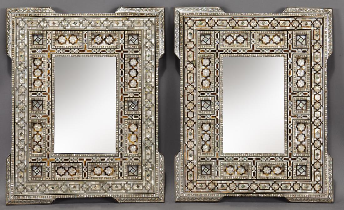 Pr. small Moorish inlaid mirrors,: Pr. small Moorish inlaid mirrors, the rectangular plate surrounded by frame with recessed squares and outset corners, with mother of pearl geometric inlay throughout. 24.5"H x 20"W, Circa - 20th C.