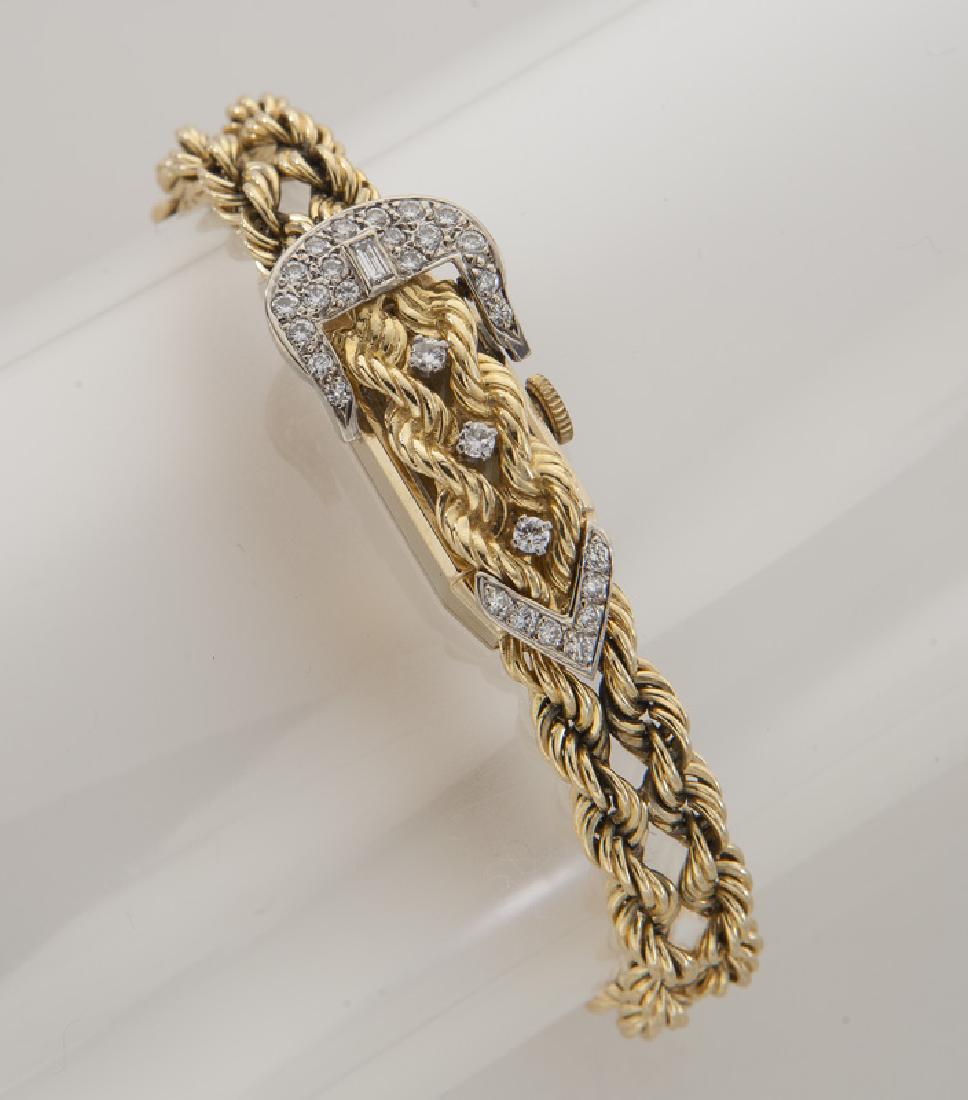 14K gold and diamond Andre Pailet bracelet watch: 14K gold and diamond Andre Pailet bracelet watch in a buckle design on an double rope bracelet with jewel movement. Stamped, "14K". 35.0 grams. 6.75"L, Circa - 20th C.