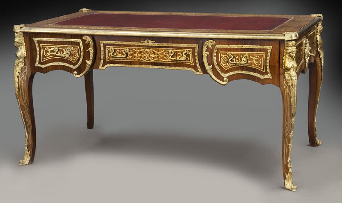 Louis XV style desk w/brass inlay & ormolu mounts: Louis XV style desk w/brass inlay & ormolu mounts the rectangular top with central inset leather panel surrounded by scrolling inlaid brass panels, with three frieze drawers framed by cast brass trim,