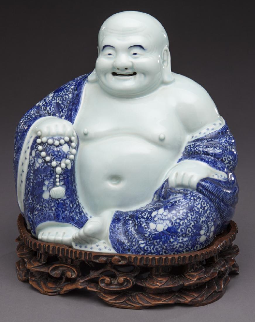Chinese Qing blue & white porcelain Buddha,: Chinese Qing blue & white porcelain Buddha, seated on a finely carved hardwood stand. Marked, "Zhu Mao Ji Zao". 11"H without stand, Circa - PROVENANCE: Estate of Ms. Louise Moorrees (maiden name). Her