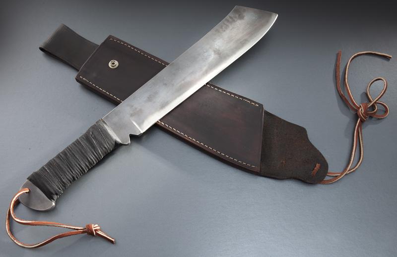 Gil Hibben Rambo #47 knife,: Gil Hibben Rambo #47 knife, with forged blade and leather wrapped handle. Marked, "Hibben Knives LaGrange KY J.R 47 of 100" and Gil Hibben signature on spine. With signed sheath #47 of 100. Blade: 12"