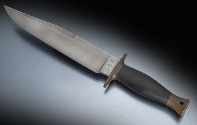 Jimmy Lile bowie knife,: Jimmy Lile bowie knife, in the English style with stick tang construction and bead blasted blade, brass double guard and pommel micarta handle, sharp swedge, lanyard hole. Blade: 9"L; Overall: 13.75"L