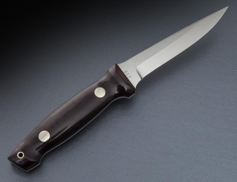 Jimmy Lile 4" Death Wind #3 mini knife,: Jimmy Lile 4" Death Wind #3 mini knife, with black micarta, NS corby lanyard. Marked, "Lile 003". With brown leather spring clip sheath. Blade: 4"L; Overall: 8"L. CONDITION: Excellent. Circa - 20th C.