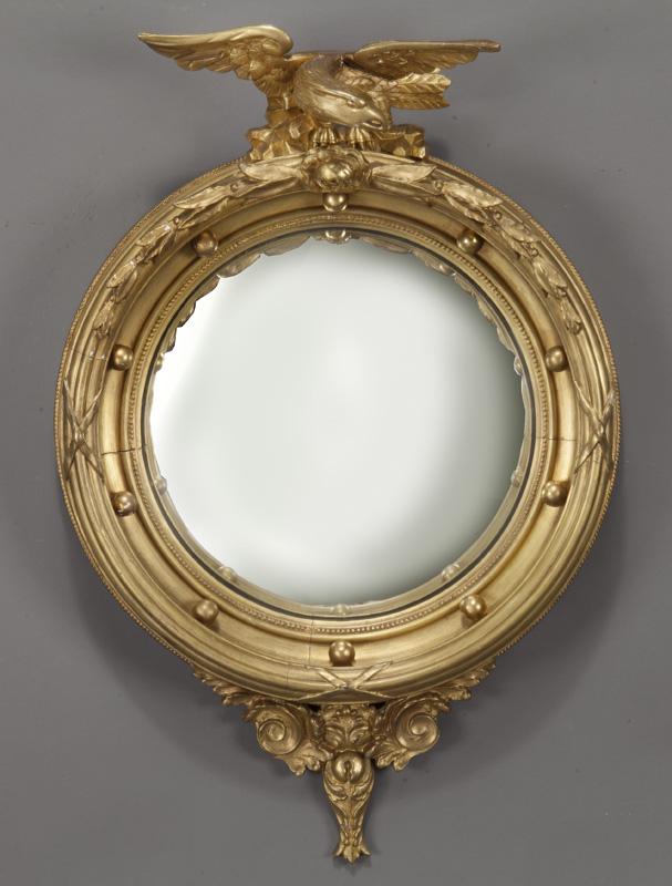 American Federal style convex mirror: American Federal style convex mirror the circular plate within a carved giltwood frame with eagle crest. 32.5"H x 21"W, Circa - 1900.