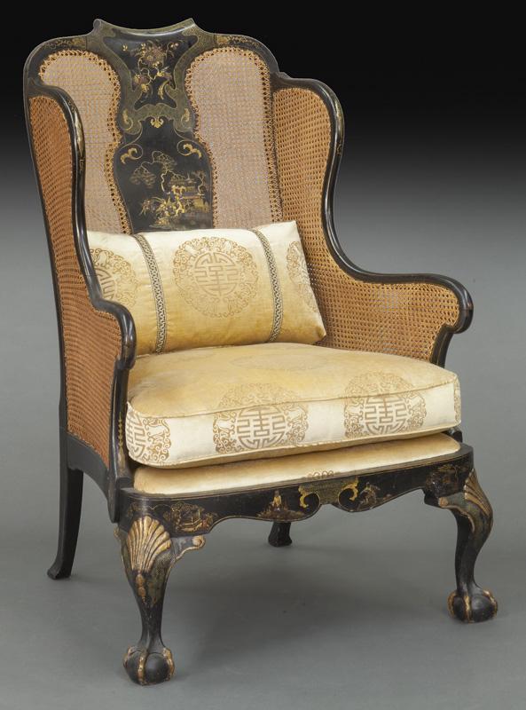 Chinoiserie decorated Queen Anne style wing chair: Chinoiserie decorated Queen Anne style wing chair with caned back, double caned sides, upholstered seat, shaped skirt and front cabriole legs with carved shell knees and carved ball and claw feet. 48.