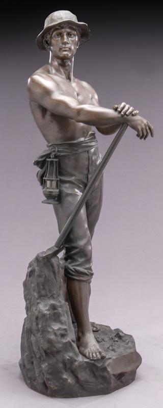 Charles Levy bronze sculpture of a miner: Charles Levy bronze sculpture of a miner standing, bare chested, holding a pick axe and a mining lamp hanging from belt. Signed in base "Ch. Levy". 31.75"H Circa - 1890.