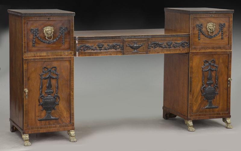 English Regency mahogany pedestal sideboard: English Regency mahogany pedestal sideboard with bowed center flanked by deep drawers over cupboards. With carved ebonized neoclassical details, crossbanding and satinwood string inlay. Front legs wit