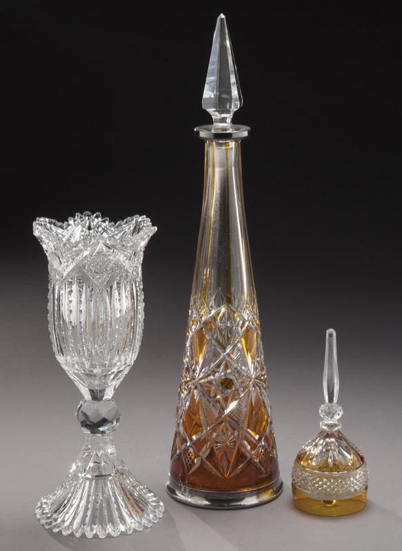 (3) Pcs. of antique cut glass,: (3) Pcs. of antique cut glass, including: (1) Baccarat amber cut to clear decanter with silver mounts, 16.75"H ; (1) American brilliant period cut glass chalice in the "Plume" pattern by J. Hoare, 10"