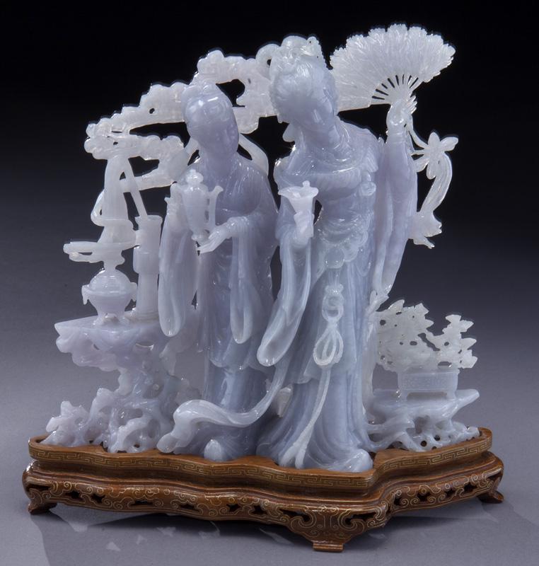 Large Chinese carved jadeite sculpture: Large Chinese carved jadeite sculpture on a inlaid carved wood stand. Overall: 10"H x 9.5"W, Circa - 20th C.