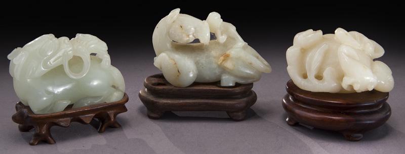 Chinese Qing carved jade toggles,: Chinese Qing carved jade toggles, depicting a monkey riding on a horse, a pomegranate, and a kylin. Largest: 2.25"L, Circa - 19th C.