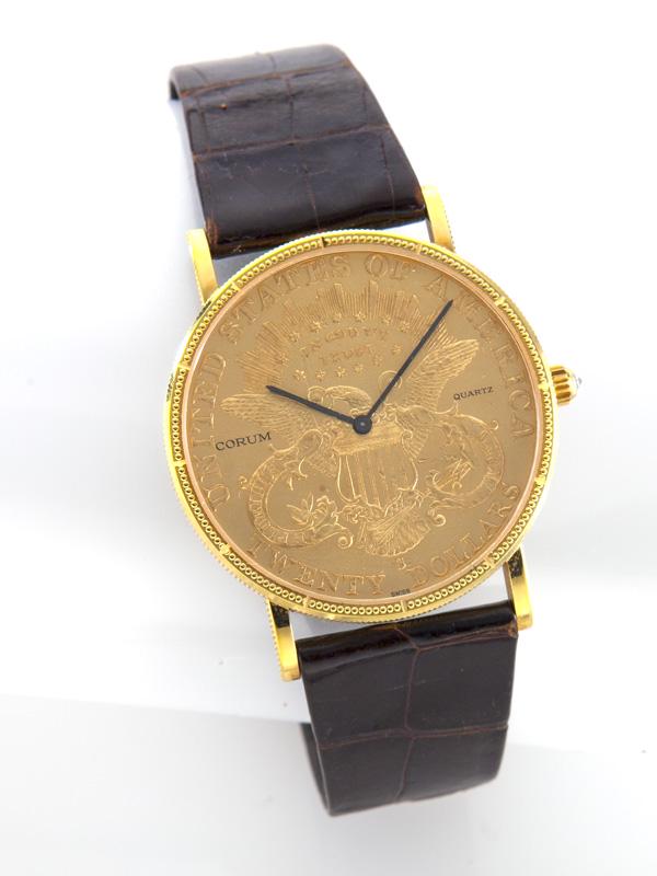 Corum $20 gold piece wristwatch: Corum $20 gold piece wristwatch on a black alligator strap, having a quartz movement. Liberty coin dated 1899. Movement number 349038. Movement, buckle and strap marked for Corum, with leather Corum p