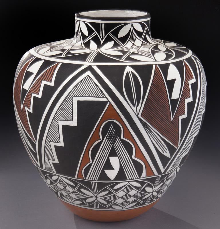 Vicki Garcia Acoma polychrome jar,: Vicki Garcia Acoma polychrome jar, the baluster form decorated with stylized floral and geometric design over red banded base. Signed, "Vicki Garcia Pueblo of Acoma, Acoma New Mexico 2-11-88". 14"H x 