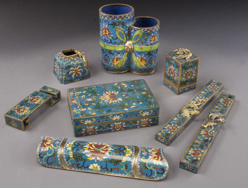 (8) Chinese cloisonne stationary items,: (8) Chinese cloisonne stationary items, including: seal box, water pot, brush pot, ink bed, wrist wrest, ink pot, and pair of paper weights. Largest: 8"L, Circa - Early 20th C.