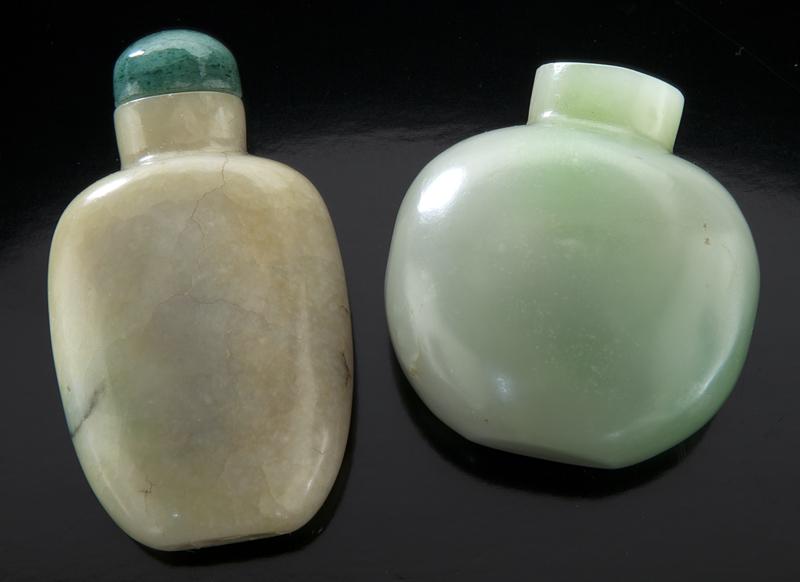 (2) Chinese jade and jadeite snuff bottles.: (2) Chinese jade and jadeite snuff bottles. (1) of circular form, of celadon tone with some natural green and cloudy white inclusion, 1.75"H; (1) of rectangular form with original stopper, well hollow