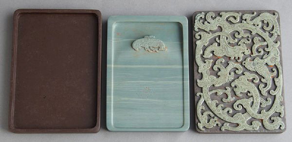 Chinese Qing Yongzheng Imperial Songhua ink stone: within a Songhua stone box, having a finely carved Kuilong dragon on top of the lid with a green ink stone and a finely carved fish design. Inscription on verso reads, "Age is old, material is smooth,