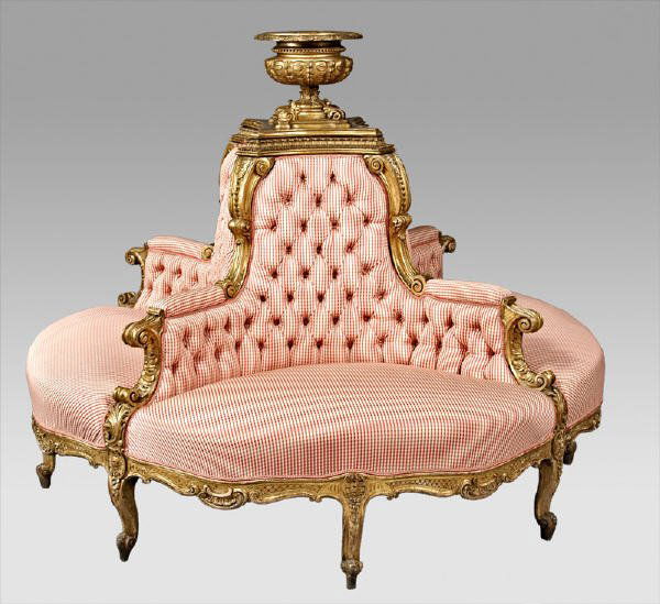 A Louis XV style circular gilt wood borne settee: the central island headed by an acanthus carved urn, carved rococo show-wood frame on a four-part button-tufted seat with carved "C" scroll and leaf apron, raised on eight cabriole legs. 49"H x 60" Di