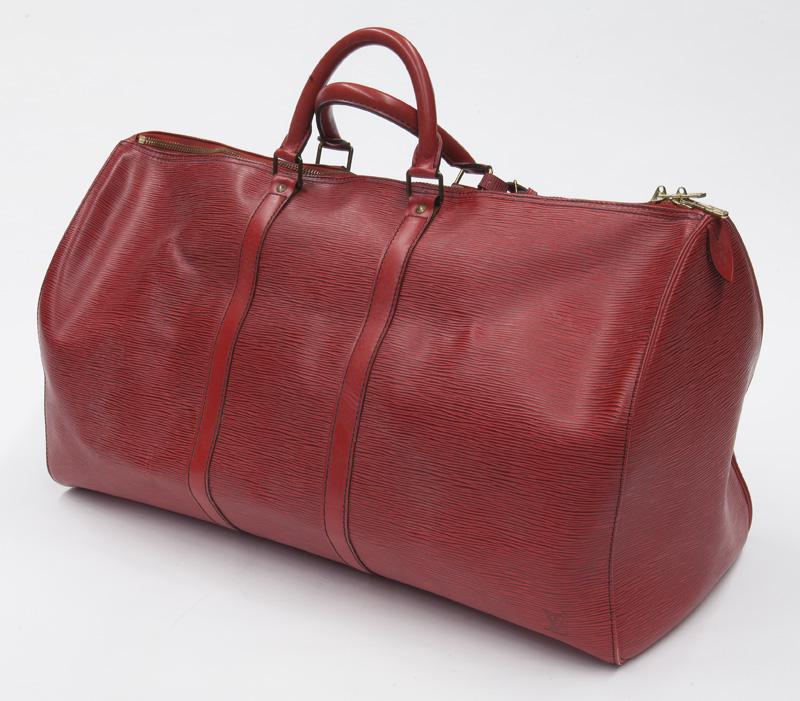 Louis Vuitton Keepall Travel Bag: Louis Vuitton Keepall Travel Bag in red Epi leather with red leather handles and golden brass hardware, marked: VI0970. Includes: luggage tag, handle strap. 22.5 x 12 x 10.25".