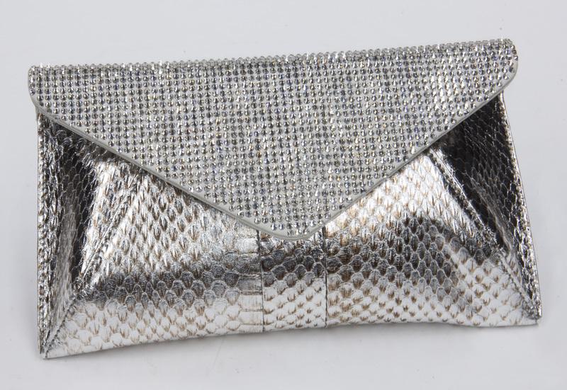 Judith Leiber Clutch,: Judith Leiber Clutch, with silver crystals, silver leather envelope exterior, and single drop-in strap. Interior lined with silver satin and marked, "Judith Leiber / Couture". Includes: certificate of