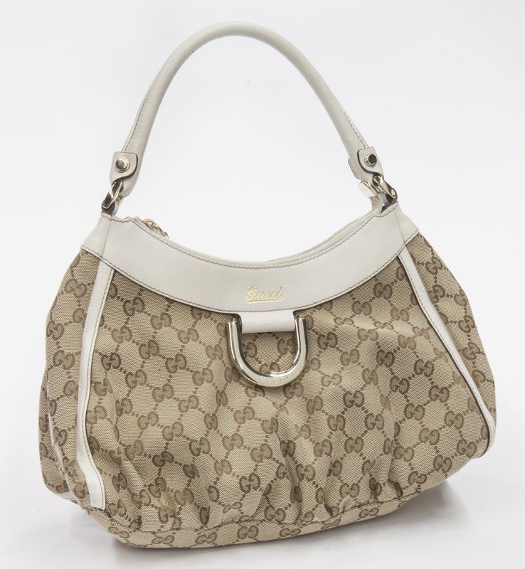 Gucci D-Ring Hobo Shoulder Bag: Gucci D-Ring Hobo Shoulder Bag in brown/beige monogrammed canvas with ivory leather handles and gold hardware, marked: 190525/493075. Includes: dust bag. 11.75 x 7.75 x 4.75".