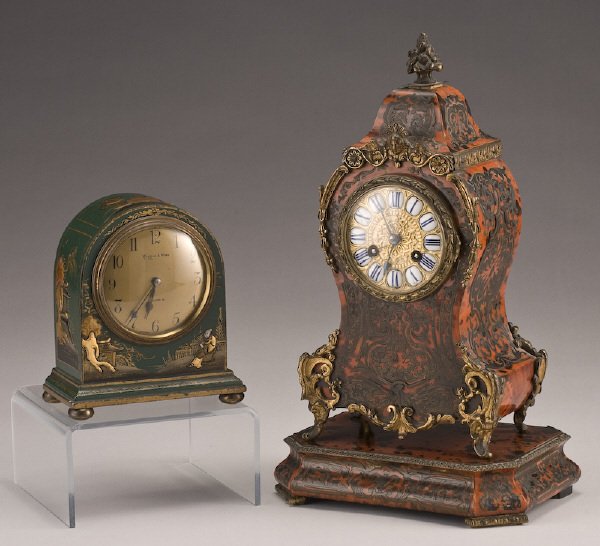(2) English shelf clocks, (1) Boulle on stand: having a brass stamped dial with enamel chapters, the brass bell and strike movement marked, "Boxell Brighton 632 44", on stand,14"H x 8"W x 5.5"D. With key. (1) Mappin and Webb Chinoiserie, with bras