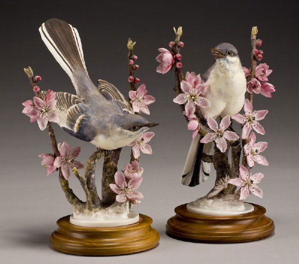 Pr. Dorothy Doughty porcelain birds, "Mockingbird": on Peach Blossom, marked, "Mimus Polyglottis", and "0932A", stamped for Royal Worcester, signed, "D. Doughty" on bases. Includes custom wood crates. Provenance: Estate of K.S. "Boots" Adams, Sr.; Form