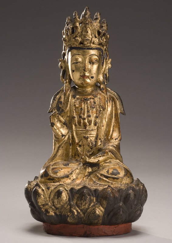 Chinese Ming dynasty gilt bronze Guanyin: seated on a lotus throne with her hands in Buddhist Mudra. 9.5"H, Circa - 16th C.