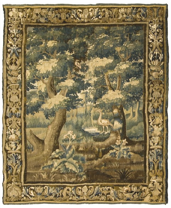 Early 18th C. Aubusson verdure tapestry: depicting a lush wooded landscape with exotic fowl within a wide scrolled border. Relined and with minor restorations. 81"W x 110"L, Circa - First quarter 18th C.