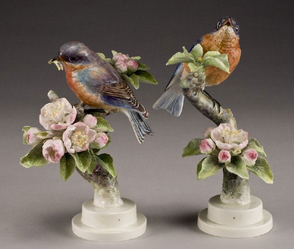 Pr. Dorothy Doughty porcelain birds, "Bluebird": with Apple Blossoms, marked "Sialia Siatis", stamped for Royal Worcester, signed, "D. Doughty". Includes custom wood crates. Provenance: Estate of K.S. "Boots" Adams, Sr.; Former President and Chairma