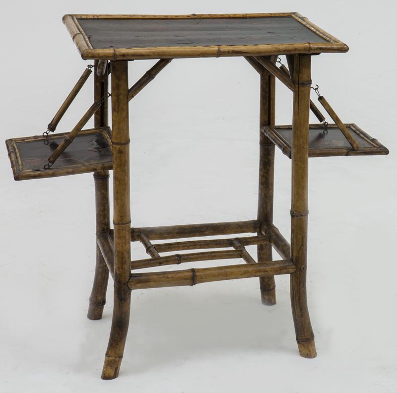 Aesthetic Movement bamboo side table,: flanked by drop down leaves, decorated with floral and bird motif. PROVENANCE: From the Vivian Young and Lady Primrose's Collection, Dallas, TX. Closed: 29"H x 21.5"W, Circa - 19th C.