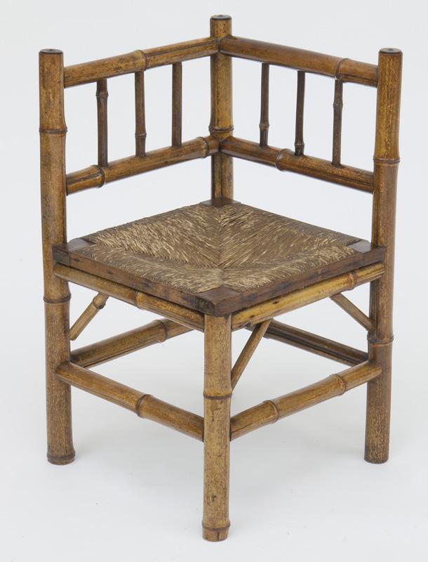 Antique English bamboo corner chair: with woven rush seat. PROVENANCE: From the Vivian Young and Lady Primrose's Collection, Dallas, TX. 29"H x 17" Sq., Circa - 1900.