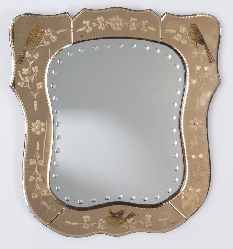 Art Deco etched glass mirror,: the pink border with reverse etched birds and florals surrounding a central mirror with reverse cut buttons. PROVENANCE: From the Vivian Young and Lady Primrose's Collection, Dallas, TX. 28"H x 26"W, 